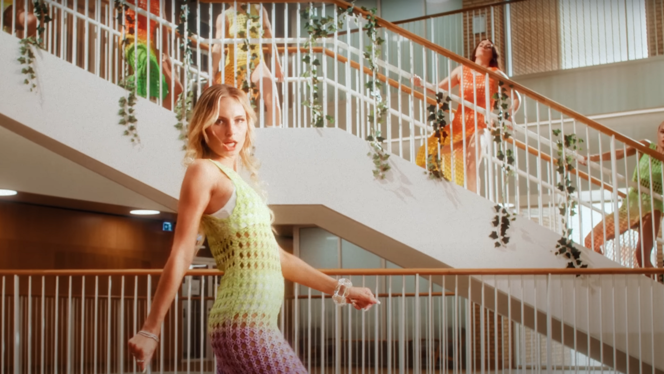 Scene from music video To The Moon by Saint Clara. The singer and her dancers are situated by the central staircase in the Skou Building